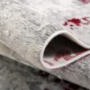 Detailed view of folded textured rug.
