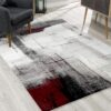 Abstract modern area rug with red accents