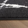 Black and white carpet on wooden floor