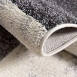 Close-up of a gray and white rug