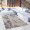 Modern living room with large rug and sofa.