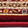 Close-up of decorative red and beige carpet edge
