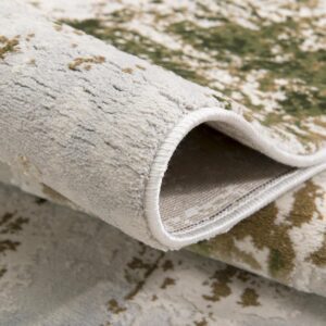 Folded patterned area rug in neutral tones.
