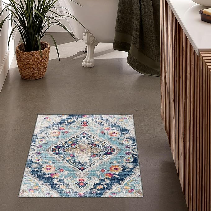 Decorative bathroom rug with intricate blue pattern.