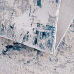 Textured abstract gray and blue area rug