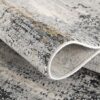 Textured gray and beige area rug close-up