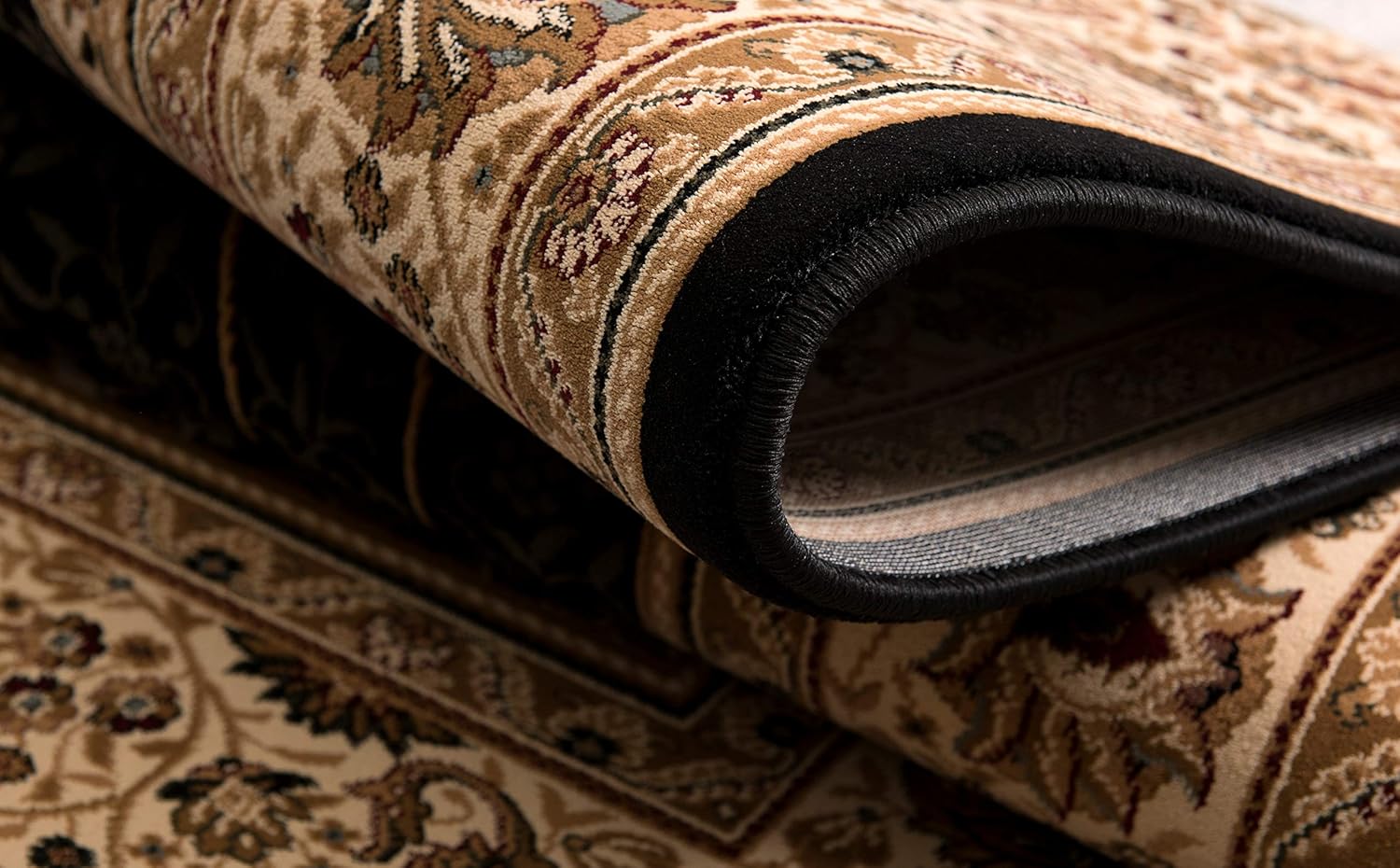 Rolled floral patterned rug close-up