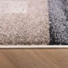 Close-up of patterned carpet on wooden floor