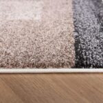 Close-up of patterned carpet on wooden floor