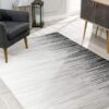 Modern gray gradient rug in stylish living room.