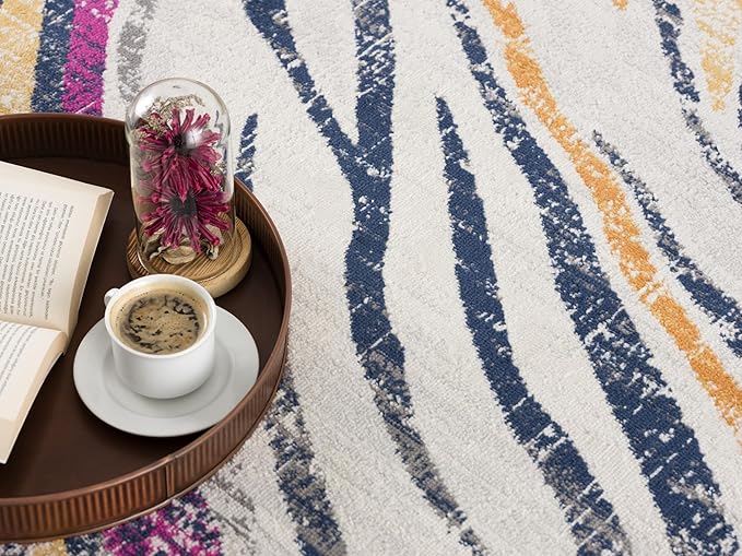 Coffee on tray with book and flowers on rug.