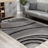 Modern gray living room with abstract rug.