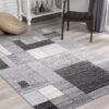 Gray geometric pattern rug in modern living room.