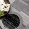 Gray geometric rug with book and flowers