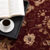 Open book and coffee on ornate carpet