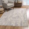Modern living room with patterned gray area rug.
