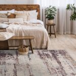 Cozy bedroom with wooden bed and vintage rug