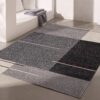 Modern gray area rug in minimalist room.