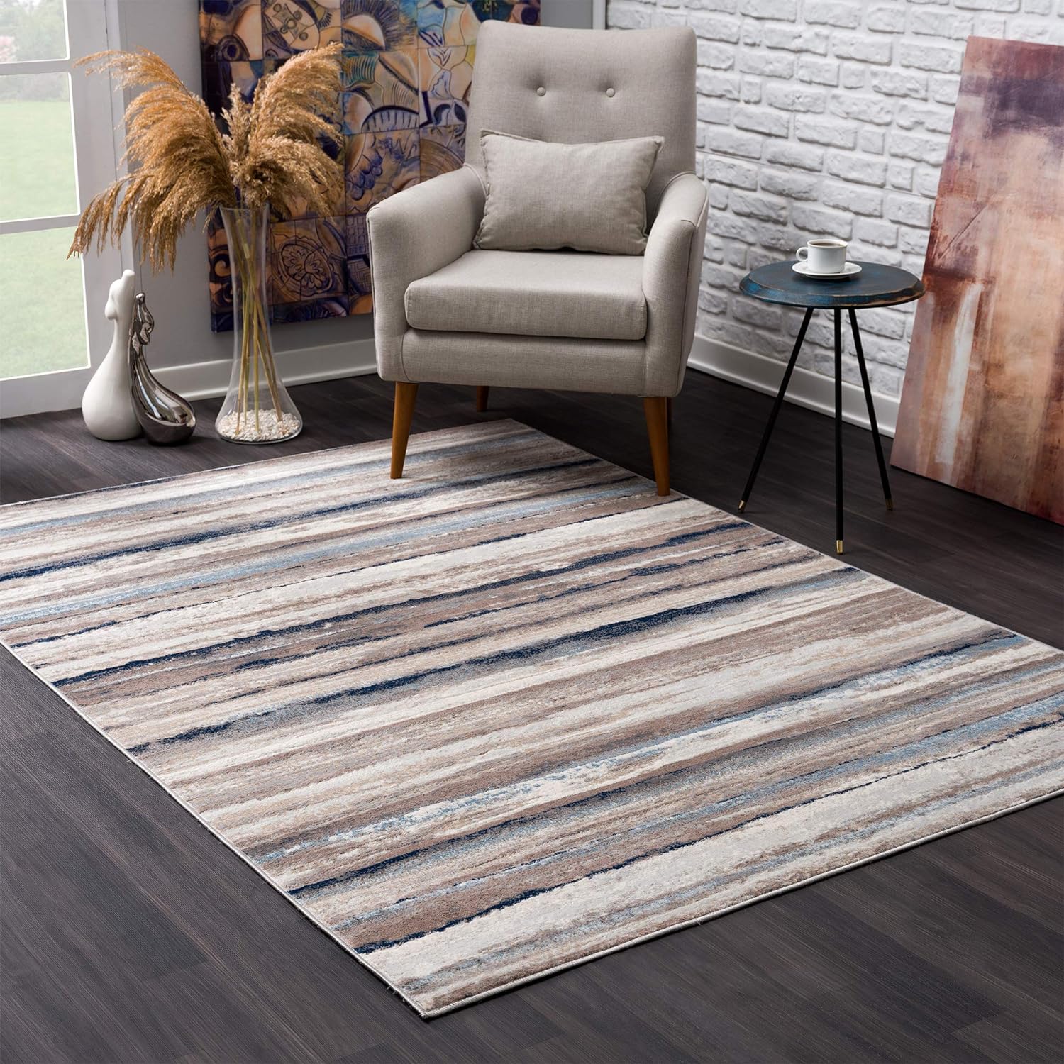 Gray armchair and striped rug in modern room