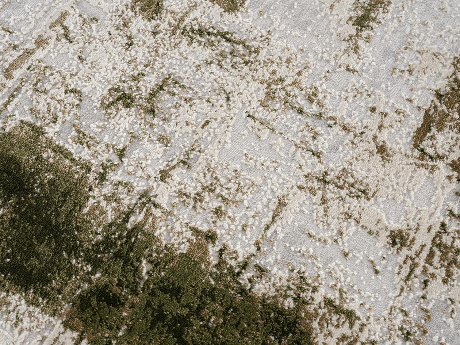 Abstract green and beige textured carpet design.