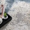 Tray with coffee and magazine on textured carpet.