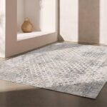 Modern gray rug in a minimalistic room interior.