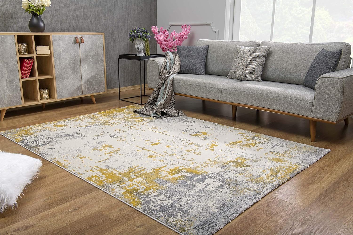 Modern living room with abstract yellow-gray rug