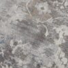 Close-up of textured gray floral carpet.