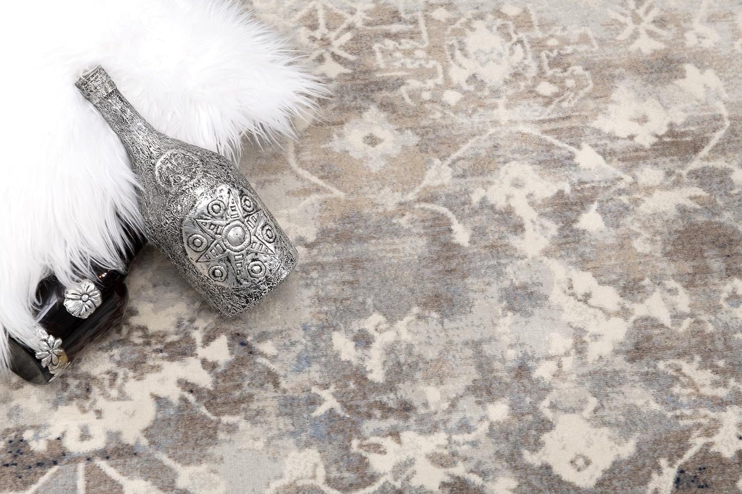 Patterned carpet with decorative bottles and fur accent