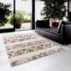 Living room with geometric patterned rug and sofa.