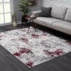 Modern living room with abstract rug design.