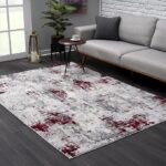 Modern living room with abstract rug design.