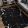 Black marble-patterned rug in modern living room.