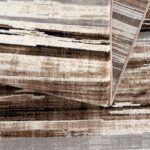 Beige and brown striped rug detail.