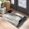Abstract rug near indoor doorway with plants