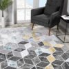 Modern geometric rug in stylish living room.