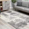 Gray geometric patterned area rug in modern living room.