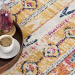 Colorful carpet with coffee and flowers on tray