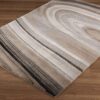 Beige and gray abstract pattern rug on floor