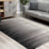 Modern living room with gray gradient rug.
