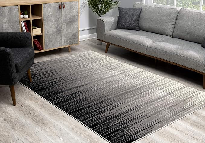 Modern living room with gray gradient rug.