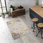 Modern kitchen with abstract rug and wooden stools.