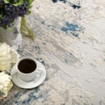 Floral bouquet and coffee on textured carpet