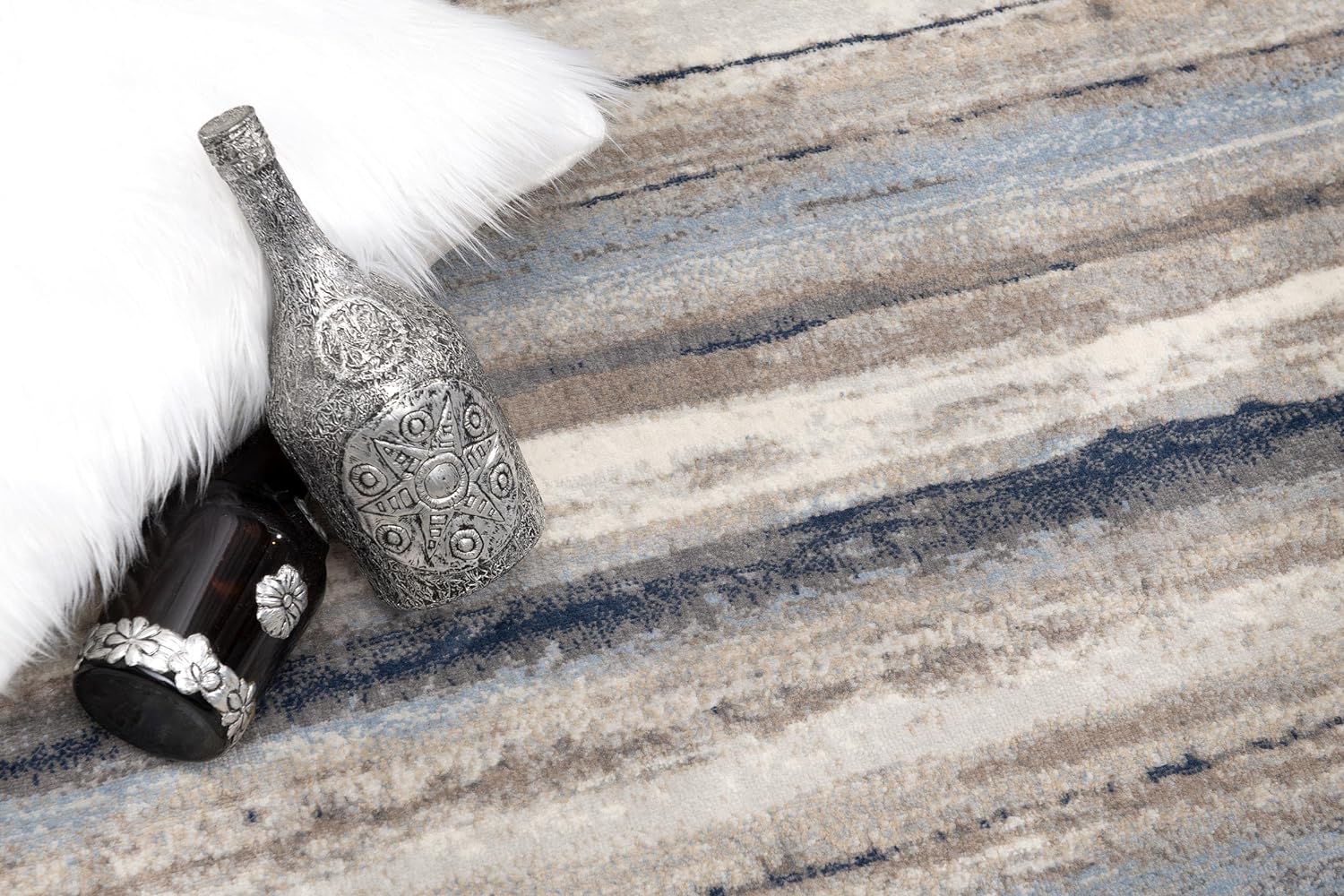 Textured carpet with decorative silver bottles.