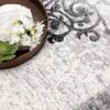 Open book and flowers on decorative rug