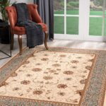 Elegant living room with rug and chair.