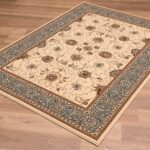 Elegant floral-patterned area rug on wooden floor.