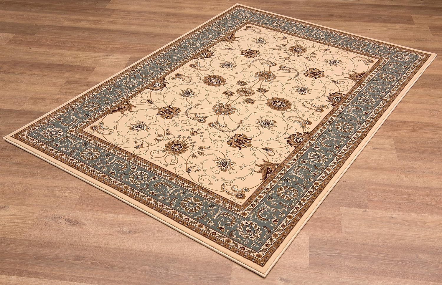 Elegant floral-patterned area rug on wooden floor.