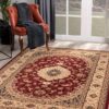 Elegant room with ornate red and beige rug.