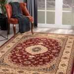Elegant room with ornate red and beige rug.